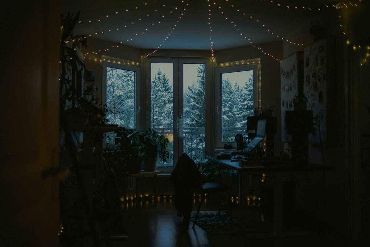 Office with commercial lighting seasonal office under which setup showing warm winter tones in December workspace