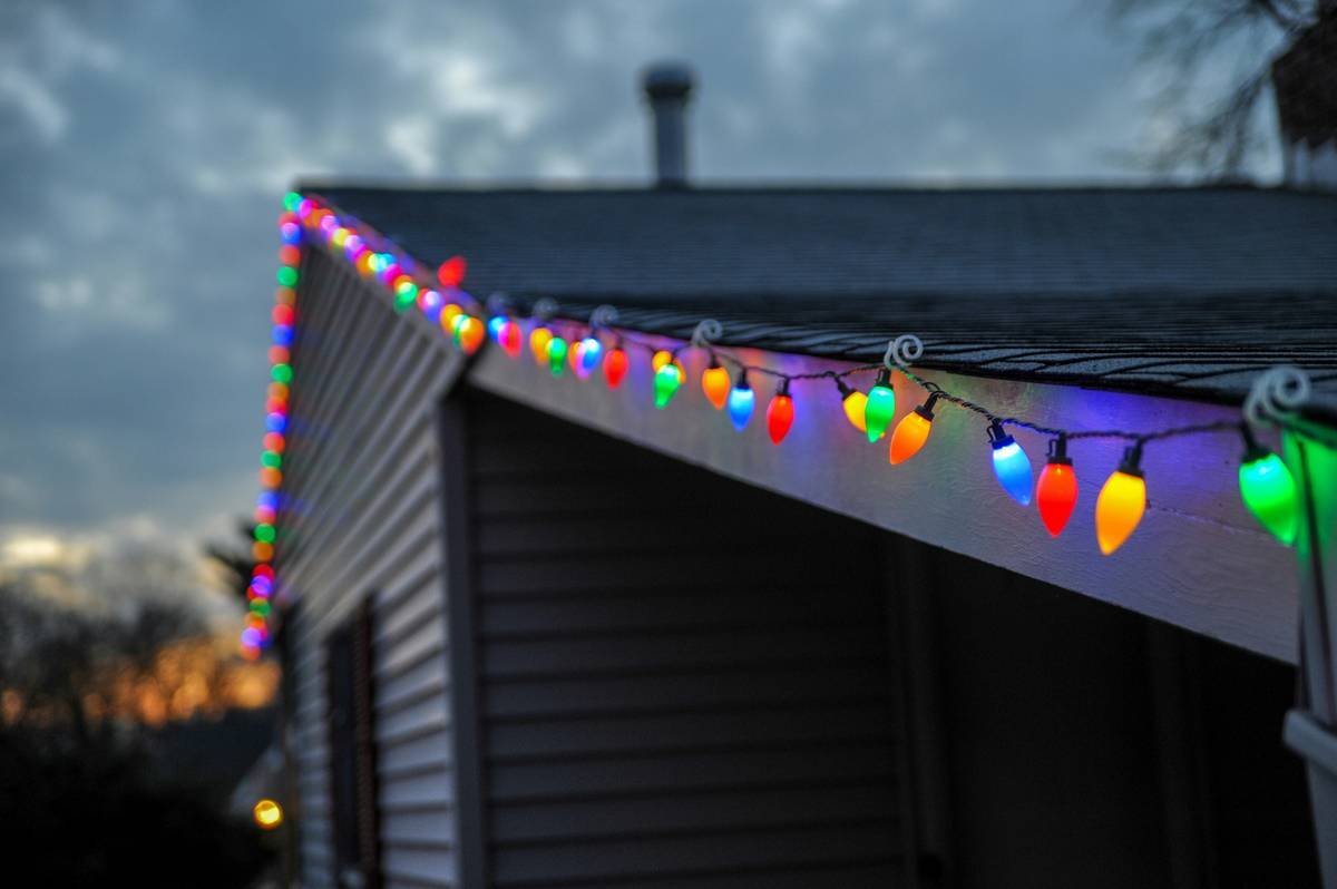 Close-up of BeamLED4 TPFR enabled fixture casting focused light on seasonal home decor items in commercial warehouse setting